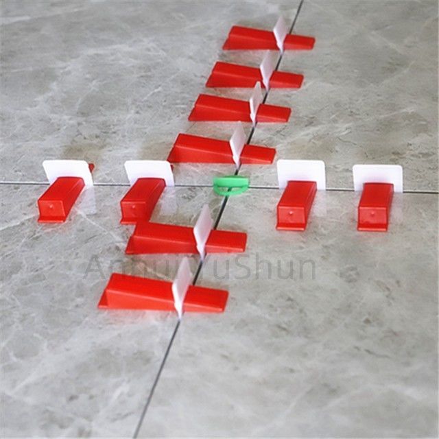 Materiali arancio neri di livellamento degli strumenti pp di colore del pavimento della parete del sistema degli accessori 2mm delle mattonelle per la posizione delle mattonelle